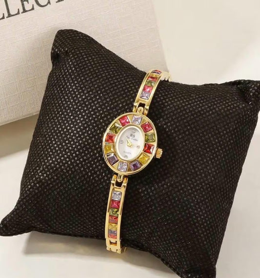 montre vintage en or et argent, montre délicate avec pierres précieuses multicolores